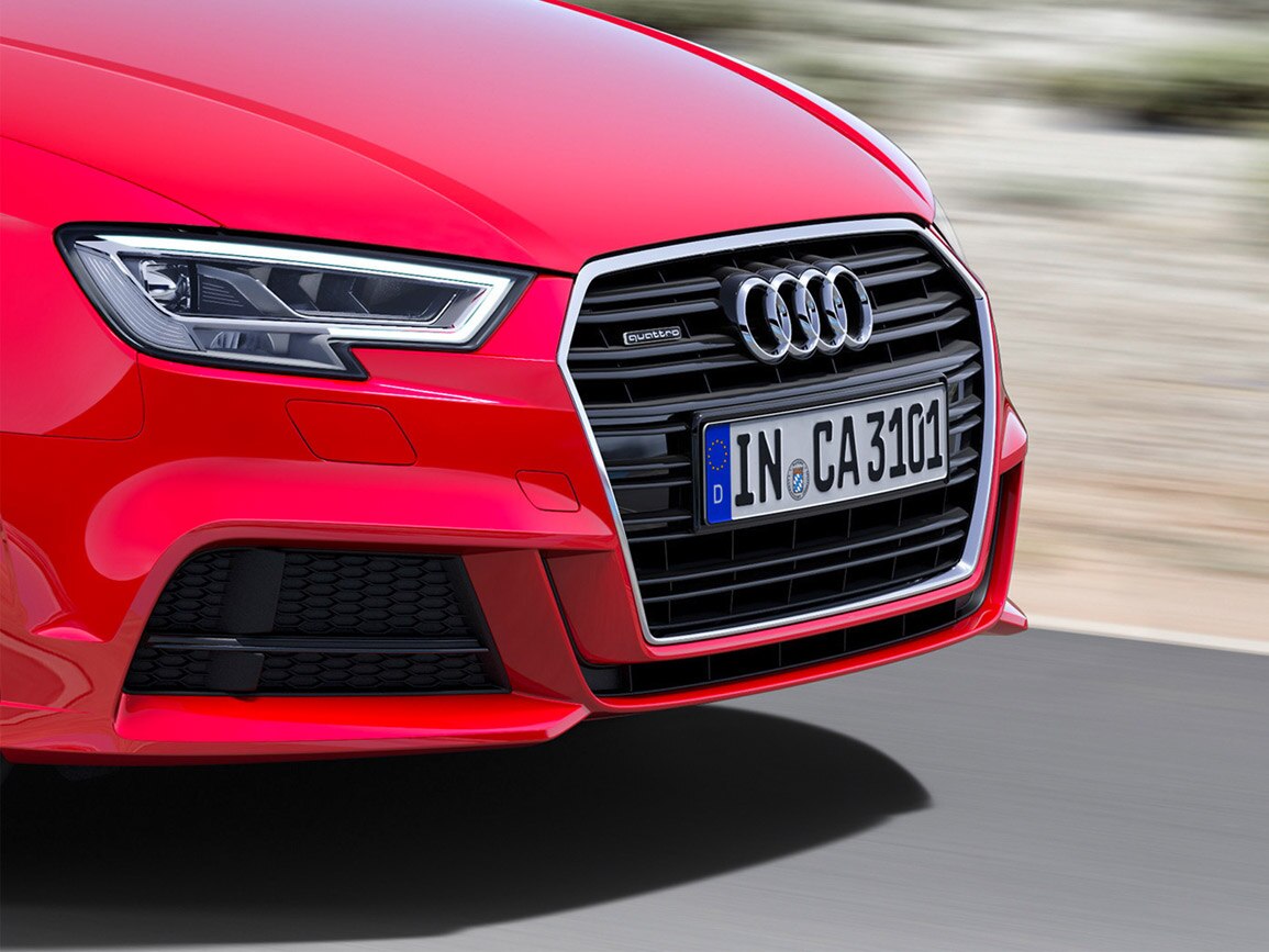 The front end of a red Audi A3 Cabriolet