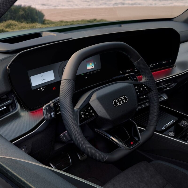 Image of the wheel and front console of the Audi Q3 SUV