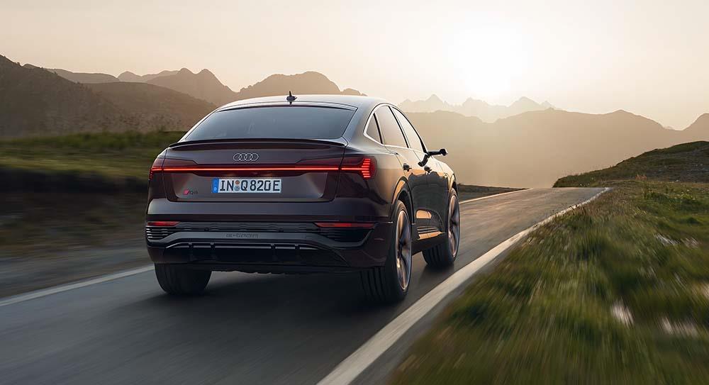 Audi Q8 e-tron from the rear driving along a road