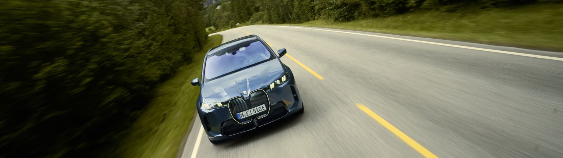 BMW iX driving on the road