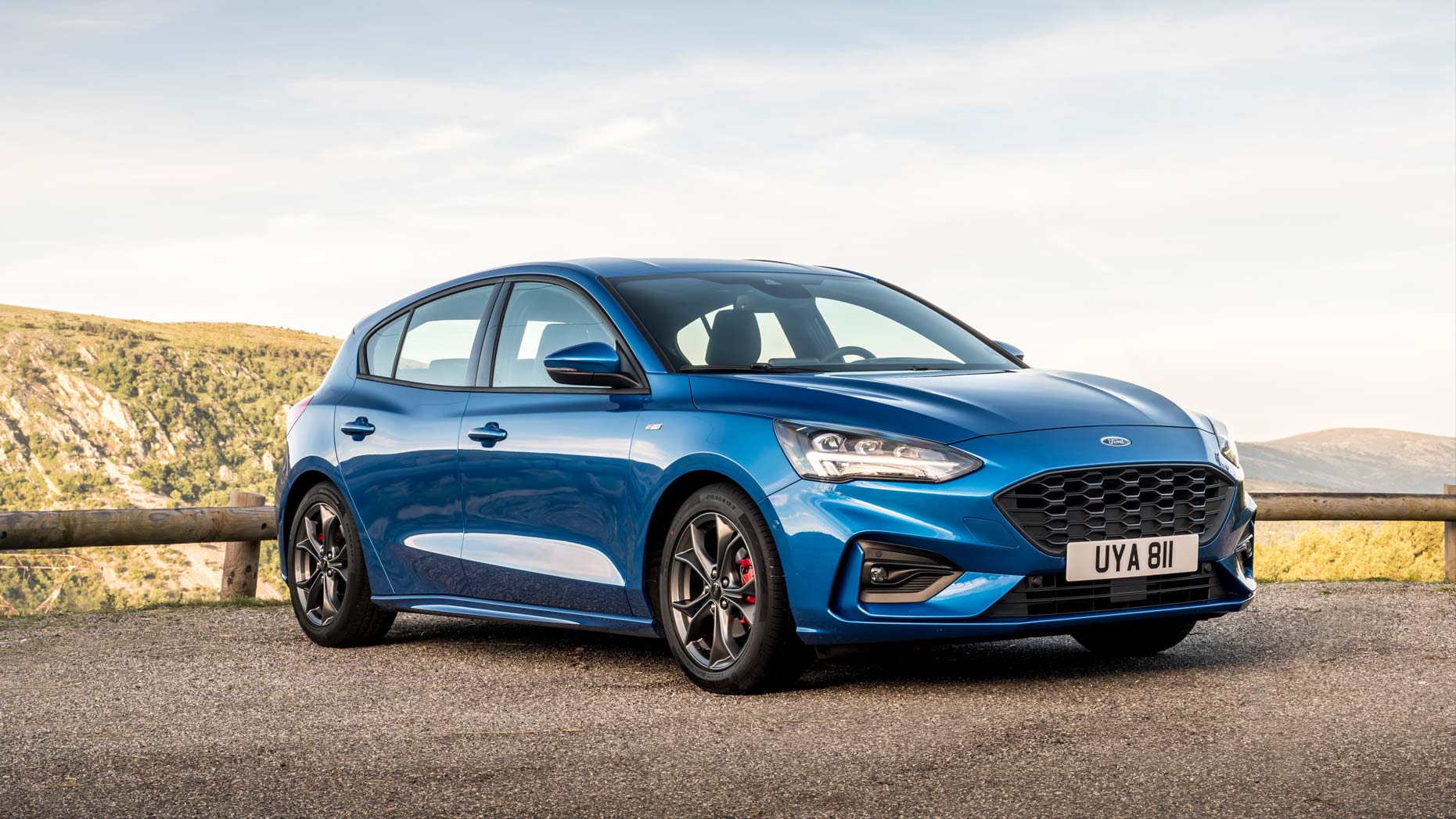 A Used Ford Focus front on shot featuring a blue second hand ford focus with red brake pads