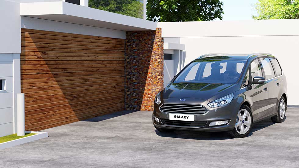 Used Ford Galaxy Header Image. Featuring a second hand grey ford galaxy front on shot of the vehicle parked outside a family home.