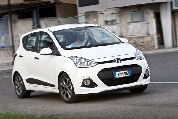 Best First Cars for young driver Ford Fiesta Image. Featuring a white Hyundai i10 front on shot.