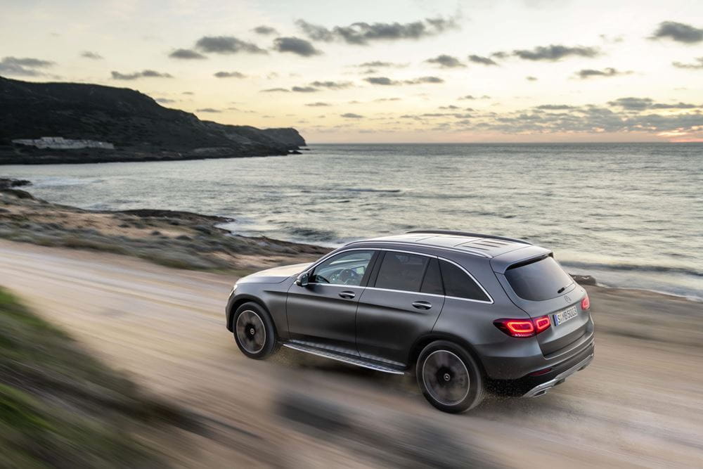 The new Mercedes-Benz GLC from behind, travelling along a coastal route
