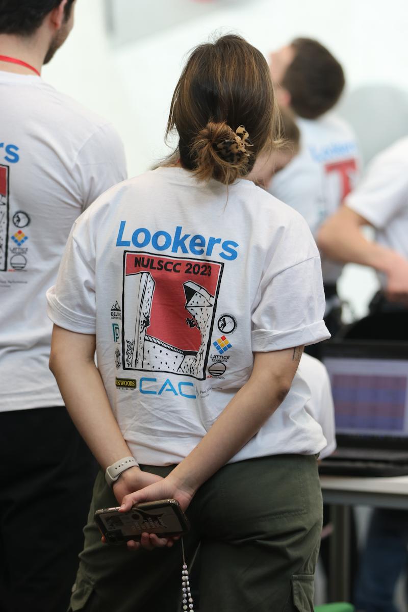 Volunteer watching the  event at the Lookers National Universities Lead and Speed Climbing Championships