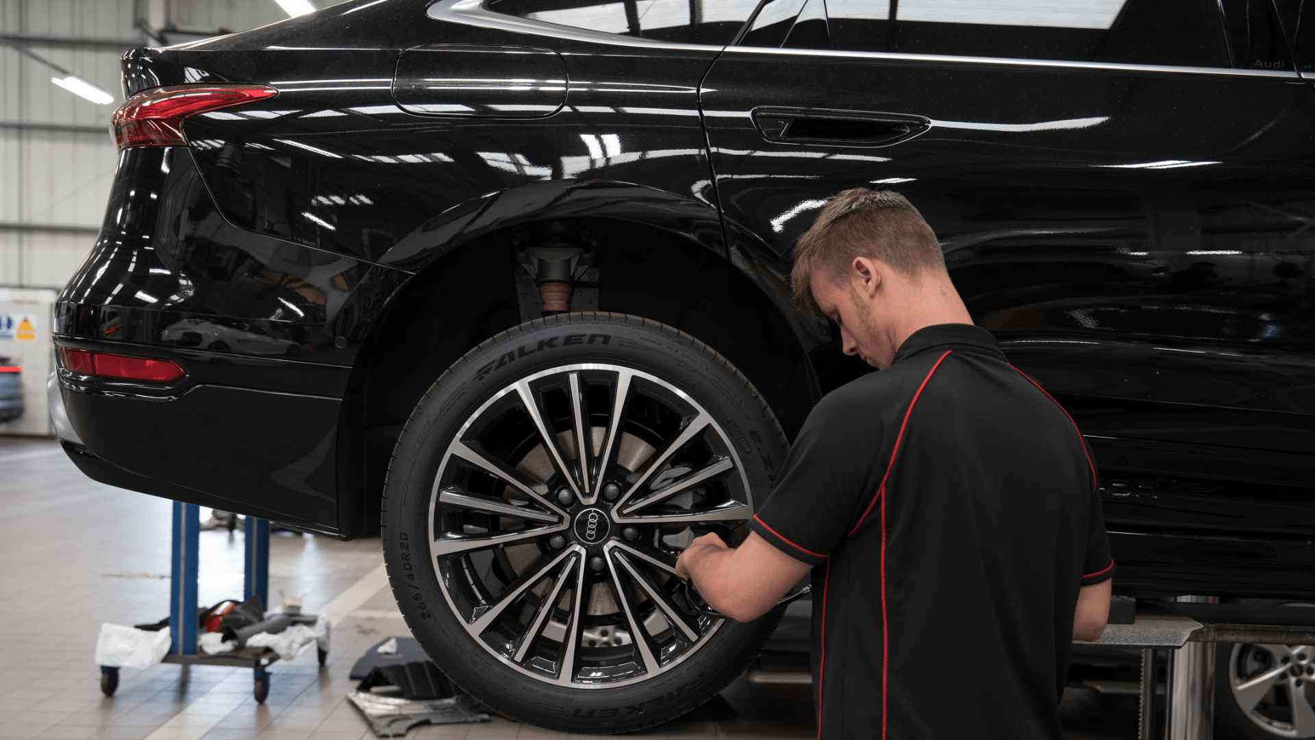 Vehicle Technician working on an alloy wheel in a Lookers Workshop