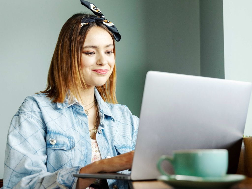 Girl in Coffee Shop on laptop