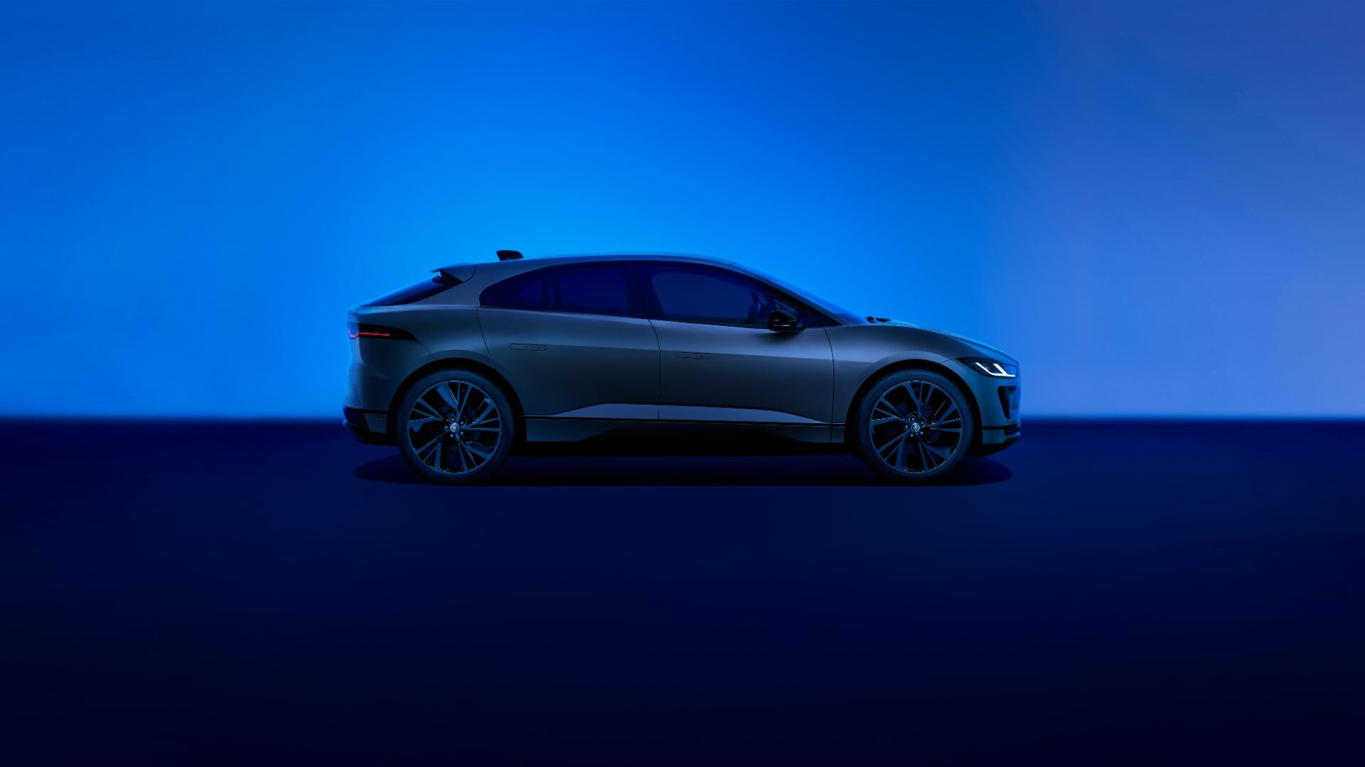 Blue Jaguar I-PACE parked side on
