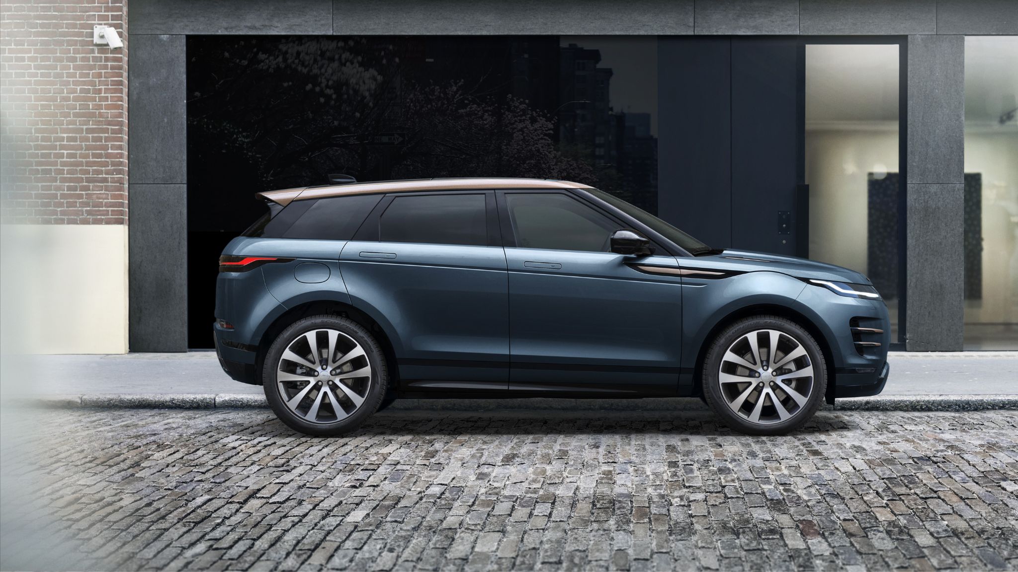 Blue Range Rover Evoque parked side on
