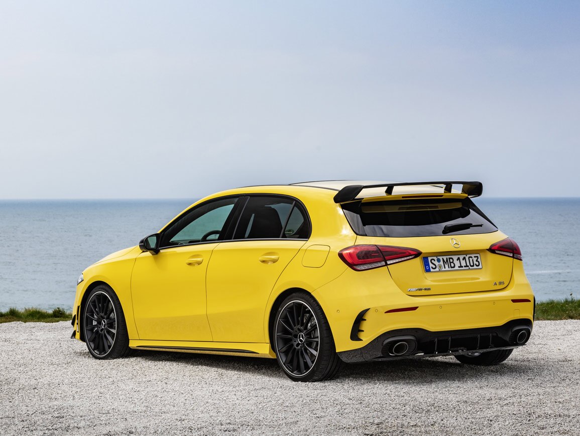 A yellow Mercedes-AMG A 35 by the coast
